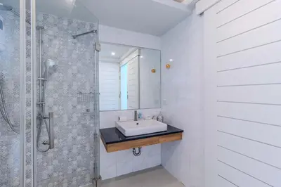 a white bathroom with a sink and a shower at V144 Luxury Private Pool Villa in Ban Saiyuan (1)