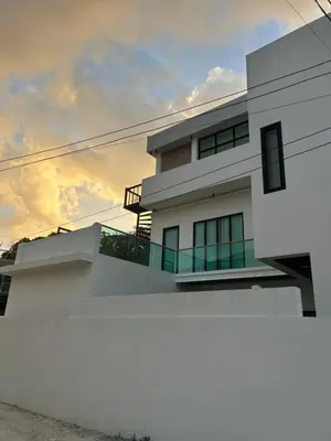 a white house with a sunset in the background at Luxury 4BR Private Pool Villa Sunset Rooftop in Phuket Town