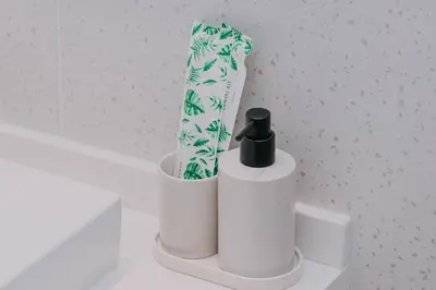 a couple of toilet paper dispensers sitting on a counter at Coastal 1 bd apartment - Moments from the sea in Layan Beach