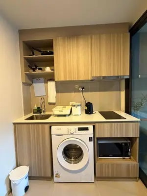a kitchen with a washing machine and a sink at Phuket, Best location, full furnished 1bedroom in Ban Rangeng