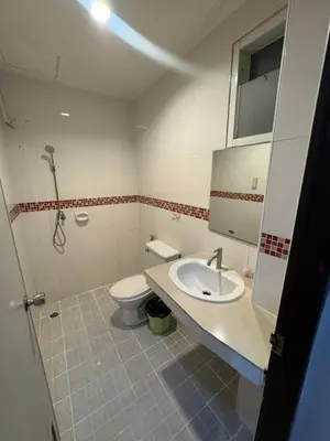 a bathroom with a sink and a toilet at Luxus Guesthouse in Patong Beach
