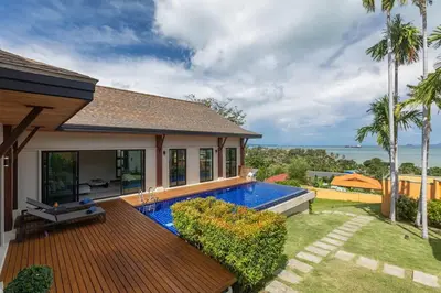 a backyard with a swimming pool and a house at Ocean-View 3-Bed Villa Retreat - Ao Yon Hillside in Ban Ao Makham