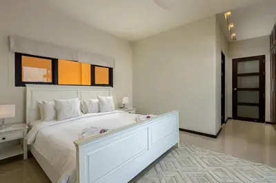 a white bedroom with a large white bed with a drawer at Ocean-View 3-Bed Villa Retreat - Ao Yon Hillside in Ban Ao Makham