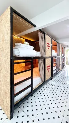 a group of bunk beds in a room at Sleep On The Clouds in Ban Kata
