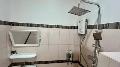 a bathroom with a shower with a mirror and a sink at Vida House Krabi, Ao Nang Beach in Ban Khlong Haeng