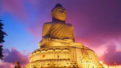 a large statue in front of a cloudy sky at Jasmine's Bungalow 3 bedroom 2 bathrooms Baby Cots in Ban Saiyuan (1)
