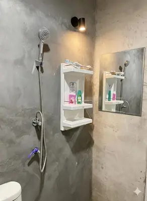 a bathroom with a shower with a shower head at Villakrabi center in Klong Muang Beach