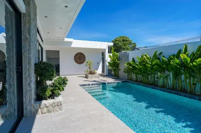 a swimming pool in the backyard of a house at Alex Villa by G Estate Phuket in Ban Saiyuan (1)