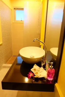 a bathroom with a sink and a counter with a sink at The Meeting House Aonang - self service in Ao Nang Beach