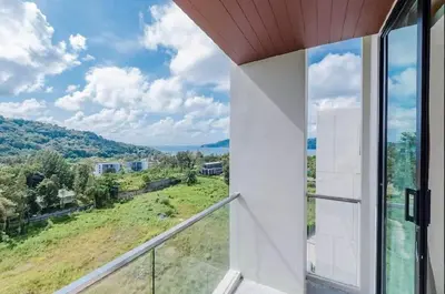 a balcony with a view of a field at The Viva Patong Condo in Patong Beach