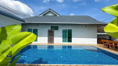 a house with a swimming pool in front of it at Soulful Stay Phuket l Phanason Park Ville 1 Near Kathu Waterfall in Ban Kathu
