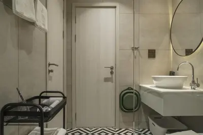 a bathroom with a shower and a sink and a mirror at Title Halo Lemon Sky Naiyang Gym Pool Hammam in Ban Bo Han