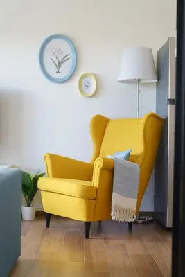 a yellow chair in a living room with a lamp at Title Halo Lemon Sky Naiyang Gym Pool Hammam in Ban Bo Han