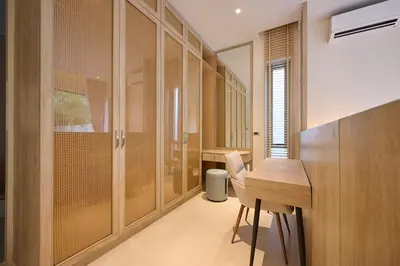 a home office with a wooden desk and a table at New Cozy 3BR Pool Villa Best Location- Boat Avenue in Ban Thalat Choeng Thale