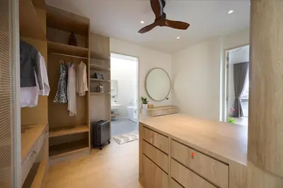 a bathroom with a dresser and a mirror at New Cozy 3BR Pool Villa Best Location- Boat Avenue in Ban Thalat Choeng Thale
