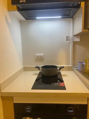 a pot sitting on top of a stove in a kitchen at D Condo Reef Kathu,Near Patong beach in Kathu