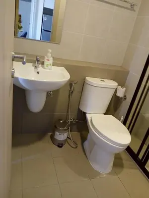 a bathroom with a toilet and a sink at D Condo Reef Kathu,Near Patong beach in Kathu