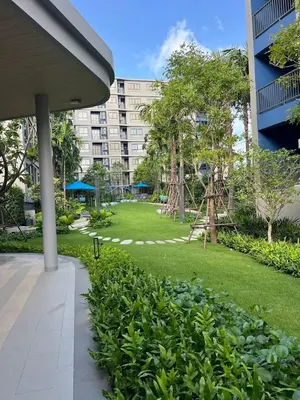 a park in front of a large building at D Condo Reef Kathu,Near Patong beach in Kathu