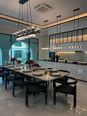 a dining room with a long table and chairs at The Title Legendary Bang-Tao Garden Harmony I-406 in Bang Tao Beach