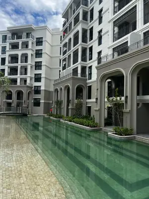 a swimming pool in front of a building at The Title Legendary Bang-Tao Garden Harmony I-406 in Bang Tao Beach