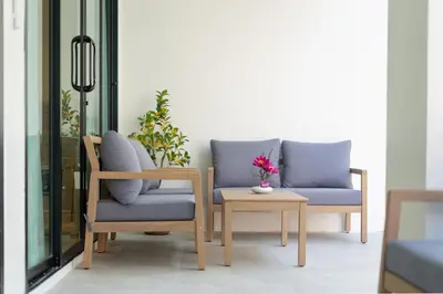 two chairs and a table in a room at Heart Patong pool villa with 5bedrooms in Patong Beach