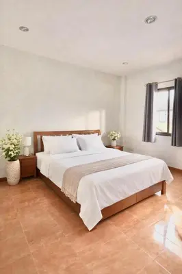 a bedroom with a large bed with white sheets at Phuket Villa - Private Pool in Ban Kathu