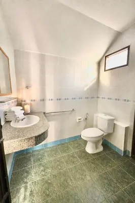 a bathroom with a toilet and a sink at Phuket Villa - Private Pool in Ban Kathu