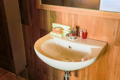 a white sink in a bathroom with a mirror at 2 bedroom pool villa 250m TO Rawai beach A5 in Rawai Beach