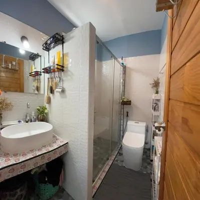 a bathroom with a shower and a sink and a toilet at Spacious Garden Loft Home Studio Workation & Fit in Ban Na Nai
