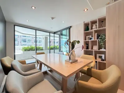 a dining room with a table and chairs at Gloria's Laguna Nest in Ban Thalat Choeng Thale