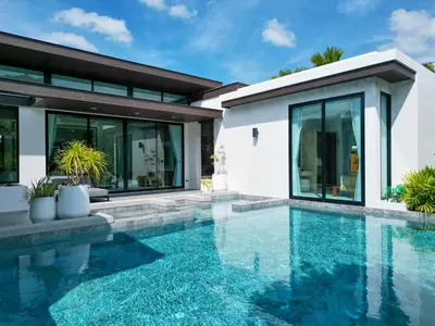 a swimming pool in front of a house at Andara Ao Nang Pool Villa in Ao Nang Beach