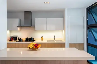 a kitchen with a bowl of fruit on a counter at Absolute Beachfront Villa 3-Bedroom in Rawai in Ban Saiyuan (1)