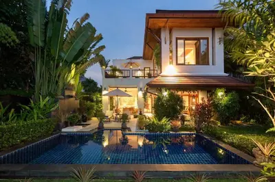 a villa with a swimming pool in front of a house at Villa Barron - Spacious Luxury Family Holiday Home in Chalong