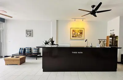 a large living room with a ceiling fan at Oh'tel Kata in Kata Beach