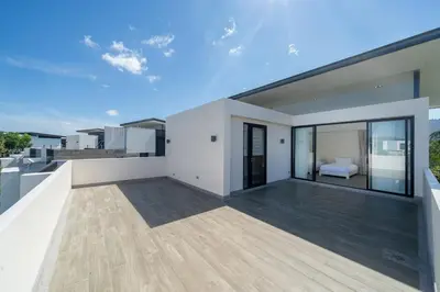 a balcony of a house with a bedroom at Friendly Lux 5 Bedroom Villa Laguna park in Laguna Phuket