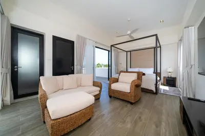 a living room with a couch and chairs and a bed at Luxury 5 bed Laguna Park no Pool in Laguna Phuket