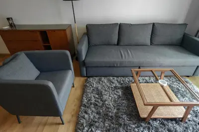 a living room with a couch and a coffee table at The Title Condo 2BR by G Estate Phuket in Phuket Town