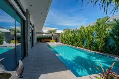an image of a swimming pool in a house at Ramon Villa by G Estate Phuket in Ban Saiyuan (1)