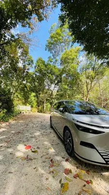 a silver car parked on a dirt road at House Party of Lee in Ban Huai Sai