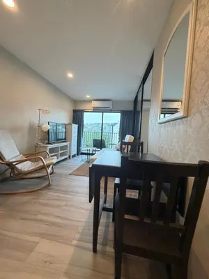a dining room with a table and chairs in a room at 1 BDR 5 Swimming Pool Entire Condo 5 Mins Walk To Naiyang Beach in Nai Yang Beach