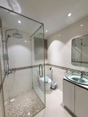 a bathroom with a shower and a toilet and a sink at Stunning 3 Bedroom pool villa in Ban Thalat Choeng Thale