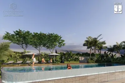 a swimming pool at a resort with people walking around it at C263 Brand New Condo Near Lake & Nai Harn Beach in Rawai Beach