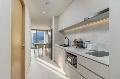 a kitchen with a sink and a counter top at C263 Brand New Condo Near Lake & Nai Harn Beach in Rawai Beach