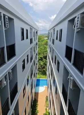 a view from between two buildings at VIP Great Hill Airport in Nai Yang Beach