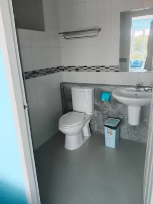 a bathroom with a toilet and a sink at Bedroom401 Kata Beach Phuket in Kata Beach