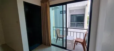 a view of a balcony with a table and chairs at Sawadee632,Naiharn&Rawai Beach Phuket in Phuket Town