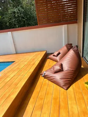 a wooden deck with two bean bags on it at Cocoloco Pool Villa Ao Nang in Ao Nang