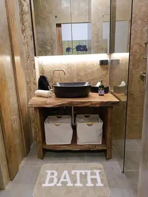 a bathroom with a sink on a wooden table at Studio in Phuket Nai Harn in Rawai Beach