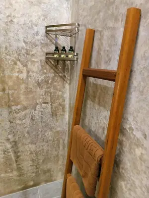 a shower with a wooden ladder and a towel at Studio in Phuket Nai Harn in Rawai Beach