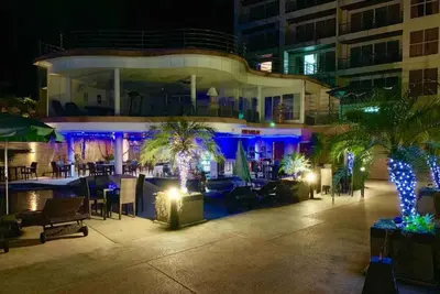 a building with blue lights on a patio at night at C257 Studio Seaview Near Beach Pool & Gym View in Patong Beach